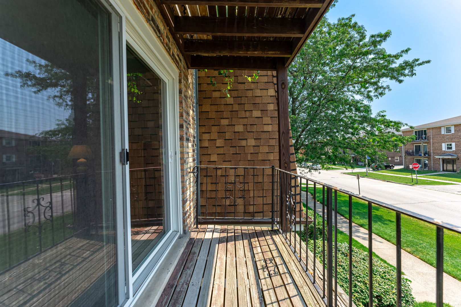 7100 99th Street, Unit 204 Chicago Ridge, IL 60415 - Photo 14 of 18 a view of a balcony with a floor to ceiling window