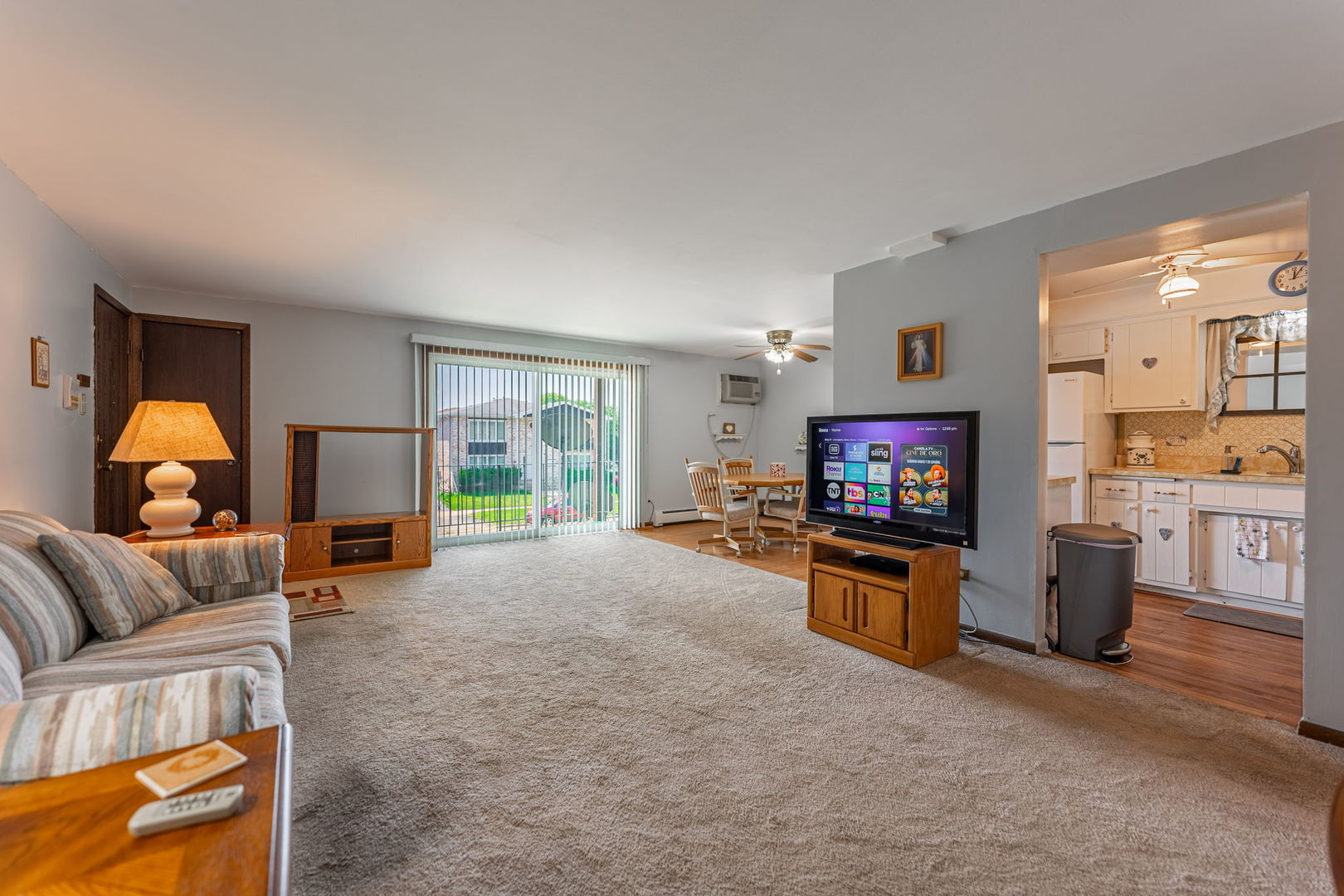 7100 99th Street, Unit 204 Chicago Ridge, IL 60415 - Photo 2 of 18 a living room with furniture and a flat screen tv