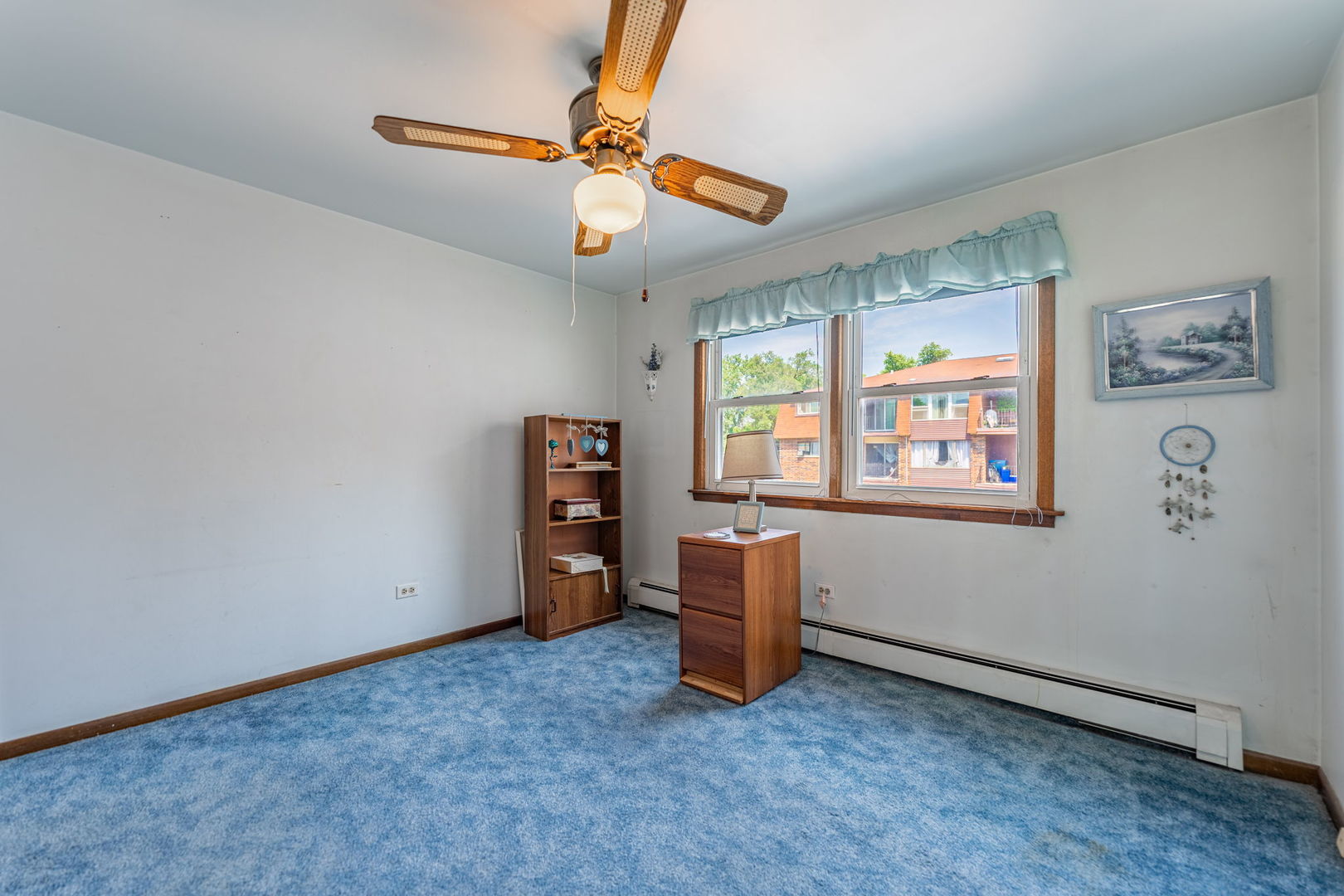 7100 99th Street, Unit 204 Chicago Ridge, IL 60415 - Photo 10 of 18 an empty room with windows and cabinet