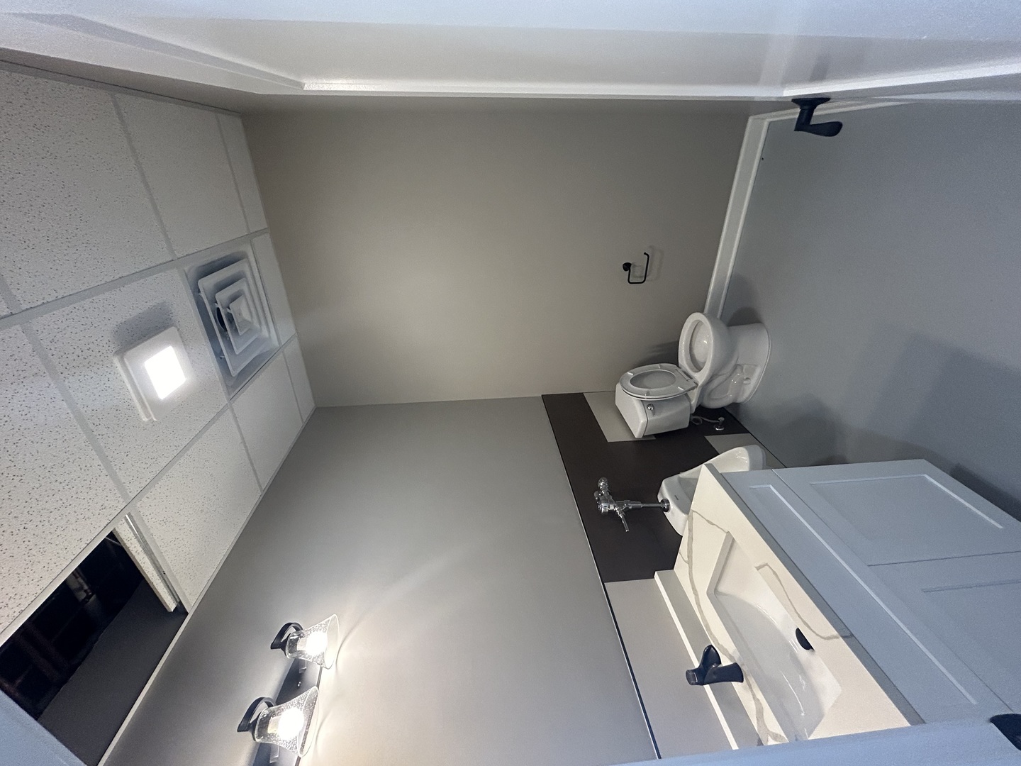 1001 Aurora Avenue, Unit A Aurora, IL 60505 - Photo 8 of 8 a bathroom with a sink mirror and toilet