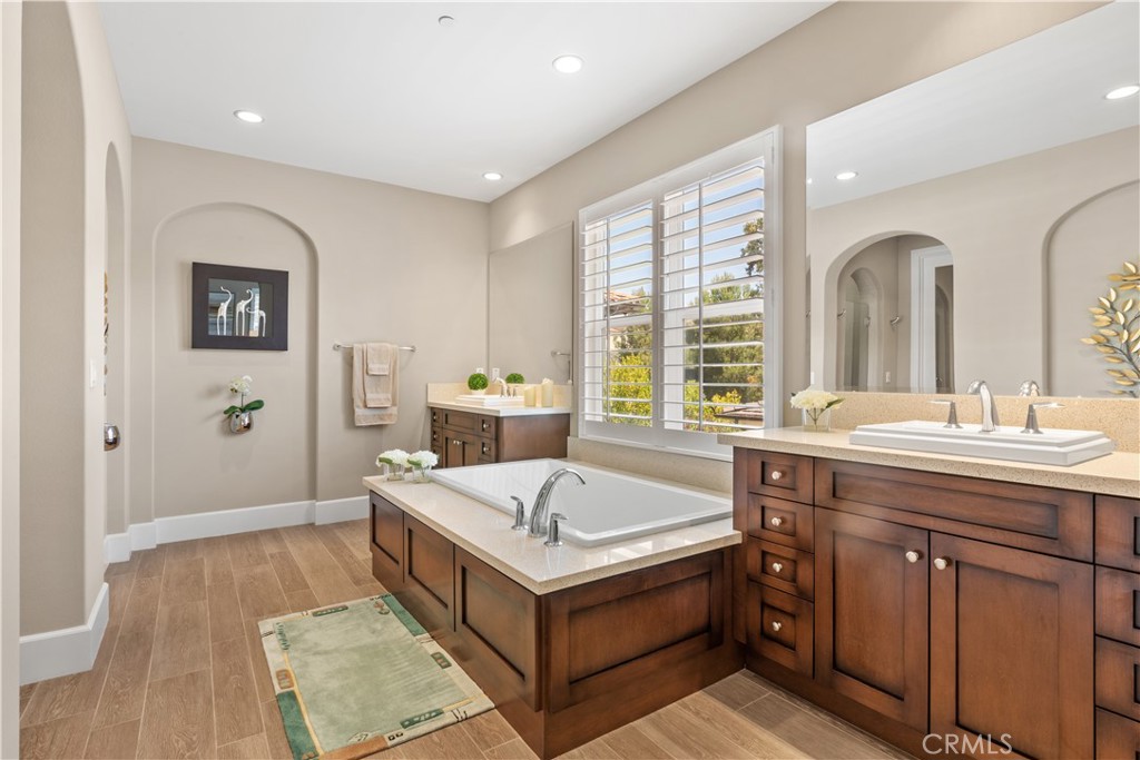 57 Harrison Irvine, CA 92618 - Photo 11 of 28 a bathroom with a tub sink and mirror