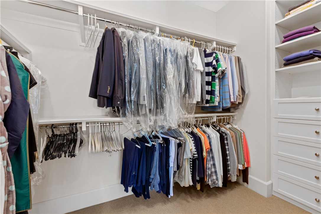 57 Harrison Irvine, CA 92618 - Photo 13 of 28 a view of walk in closet with clothes and shoes