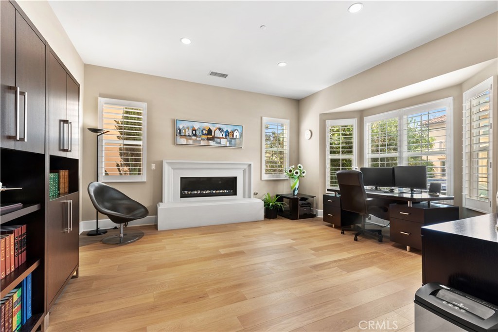 57 Harrison Irvine, CA 92618 - Photo 2 of 28 a living room with furniture tv and a fireplace