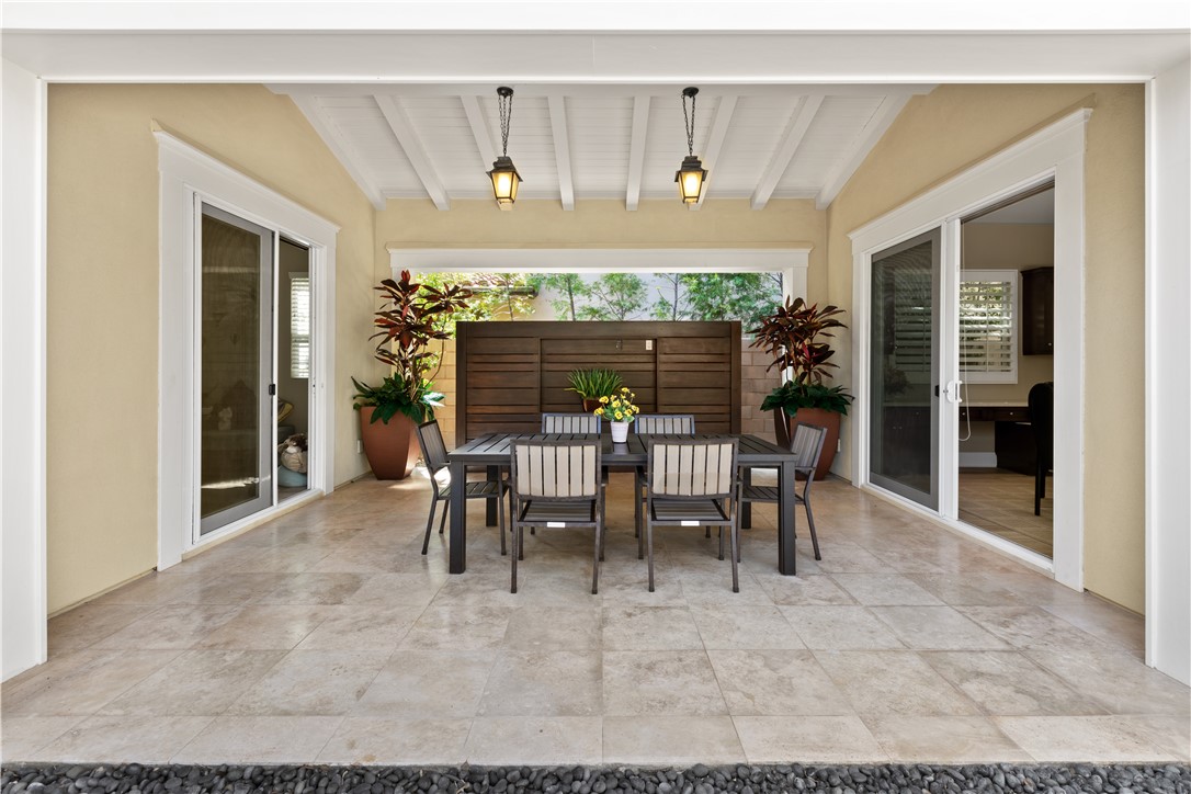 57 Harrison Irvine, CA 92618 - Photo 24 of 28 a dining room with furniture and a chandelier