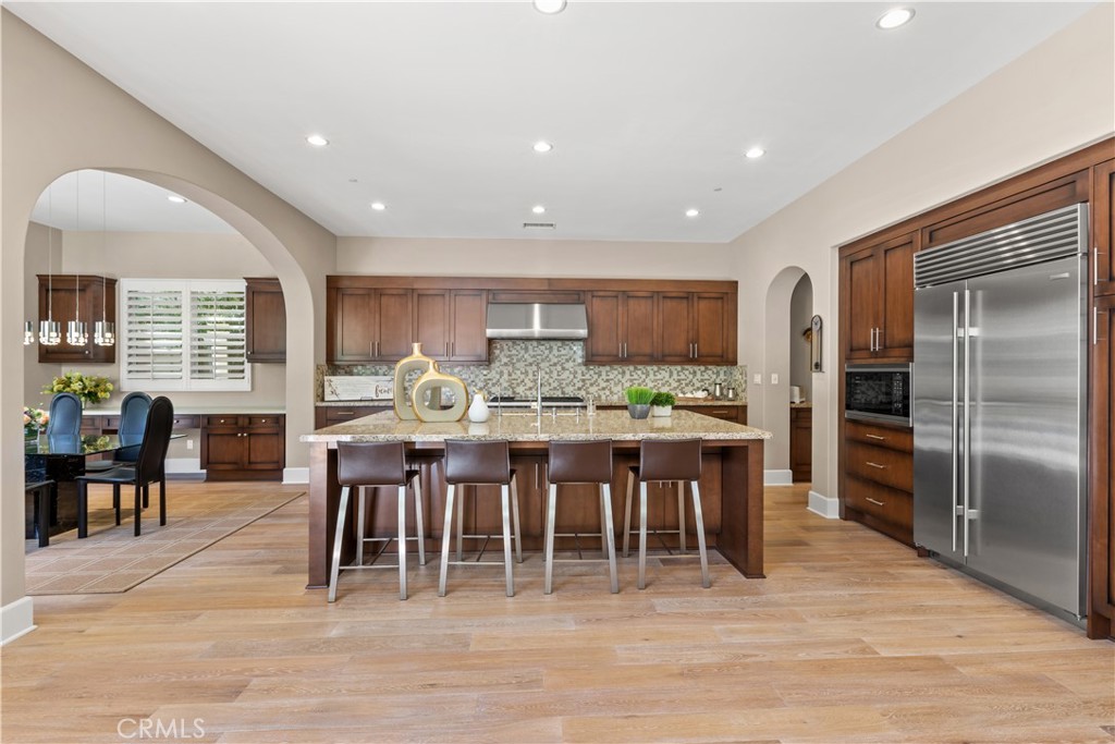57 Harrison Irvine, CA 92618 - Photo 6 of 28 a large kitchen with a table and chairs