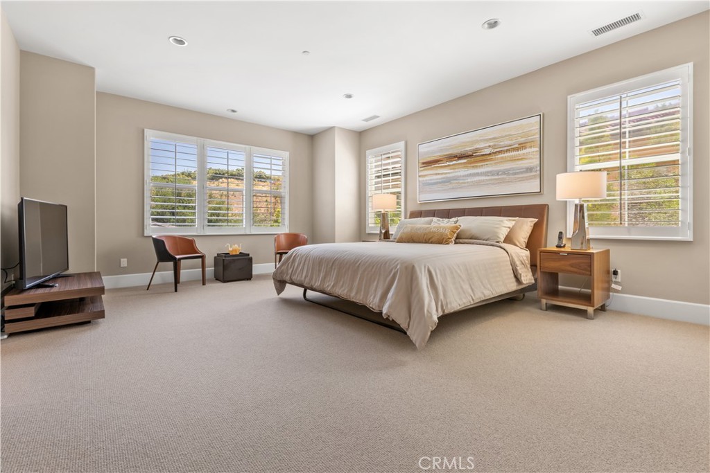 57 Harrison Irvine, CA 92618 - Photo 10 of 28 a bedroom with a bed and a flat screen tv