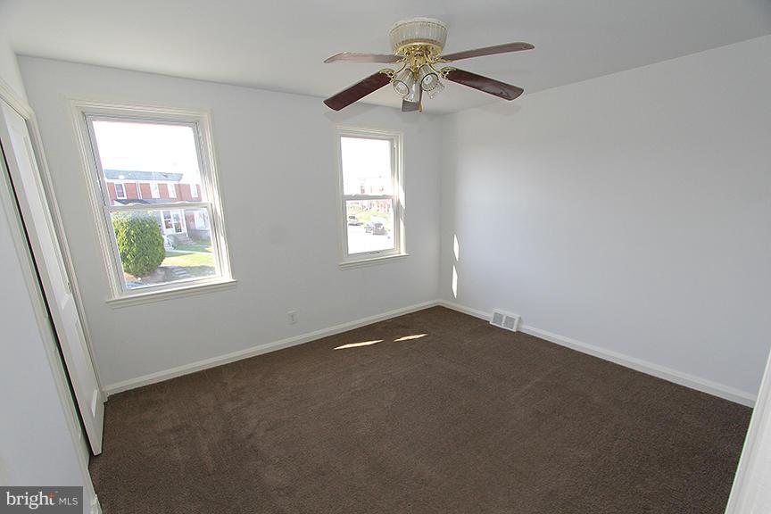 7436 Manchester Road Dundalk, MD 21222 - Photo 7 of 16 a view of an empty room with a window