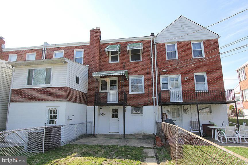 7436 Manchester Road Dundalk, MD 21222 - Photo 8 of 16 a front view of a house with garden