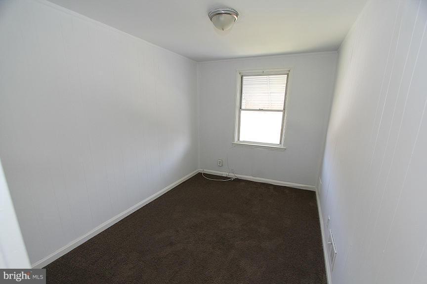 7436 Manchester Road Dundalk, MD 21222 - Photo 10 of 16 an empty room with a window