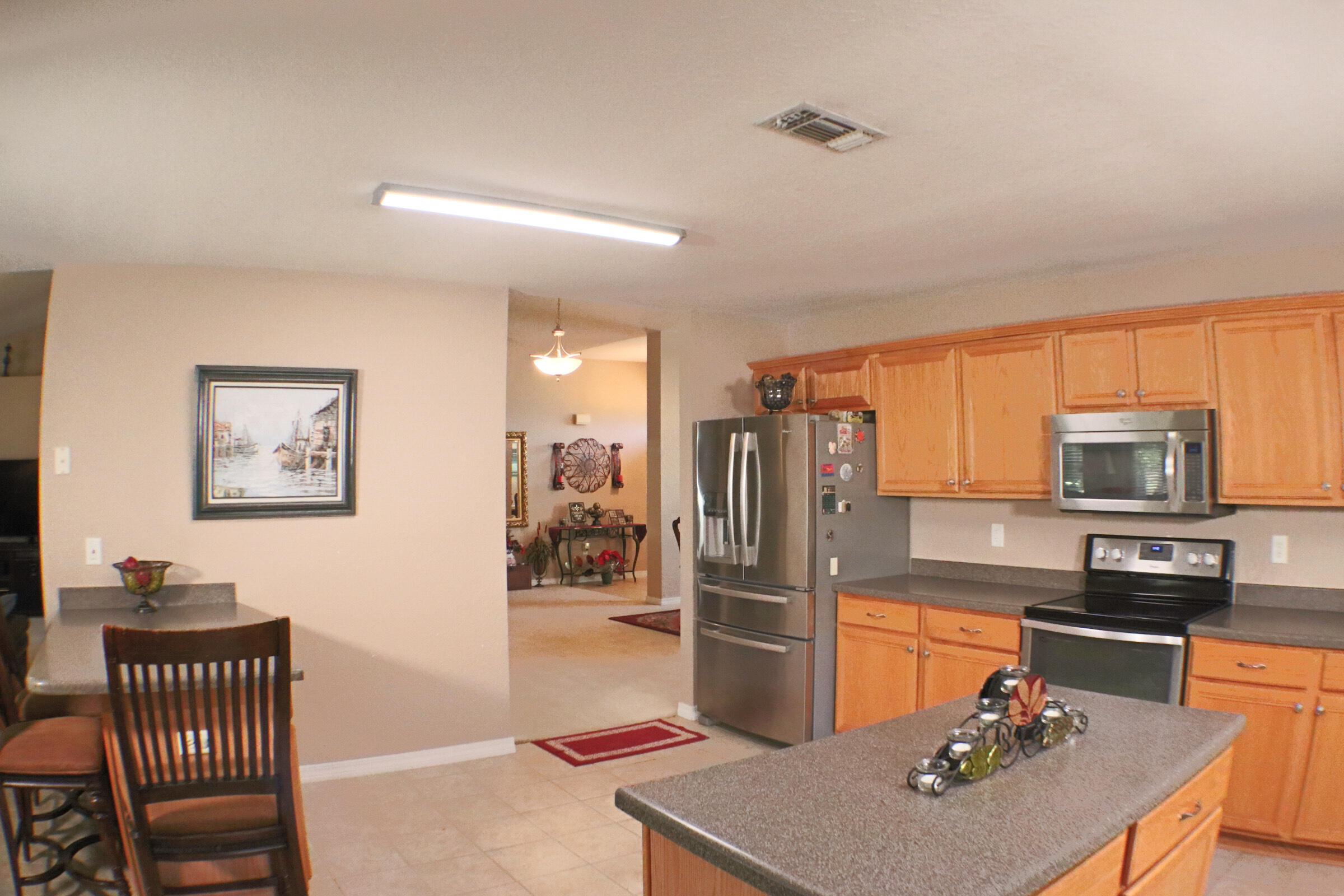 564 East Shipwreck Road Santa Rosa Beach, FL 32459 - Photo 12 of 38 a kitchen with stainless steel appliances granite countertop a refrigerator and a stove top oven