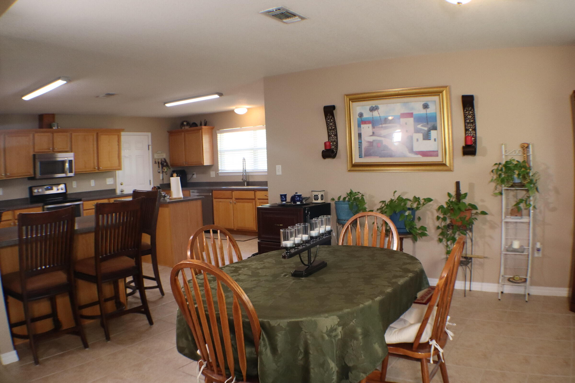 564 East Shipwreck Road Santa Rosa Beach, FL 32459 - Photo 13 of 38 a view of a a dining room with furniture window and wooden floor