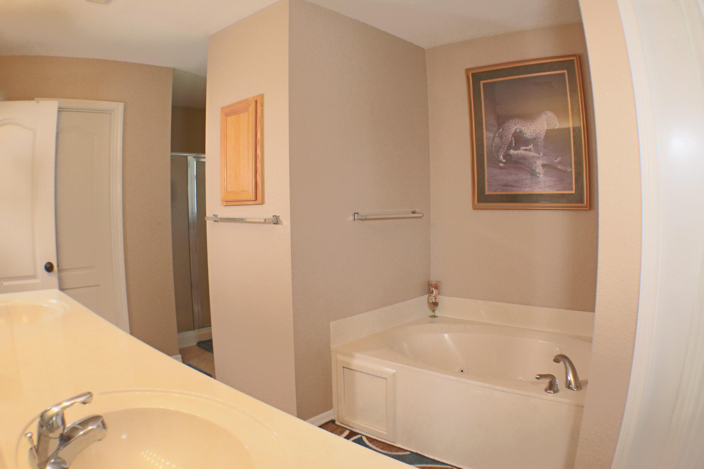 564 East Shipwreck Road Santa Rosa Beach, FL 32459 - Photo 18 of 38 a bathroom with a tub and shower