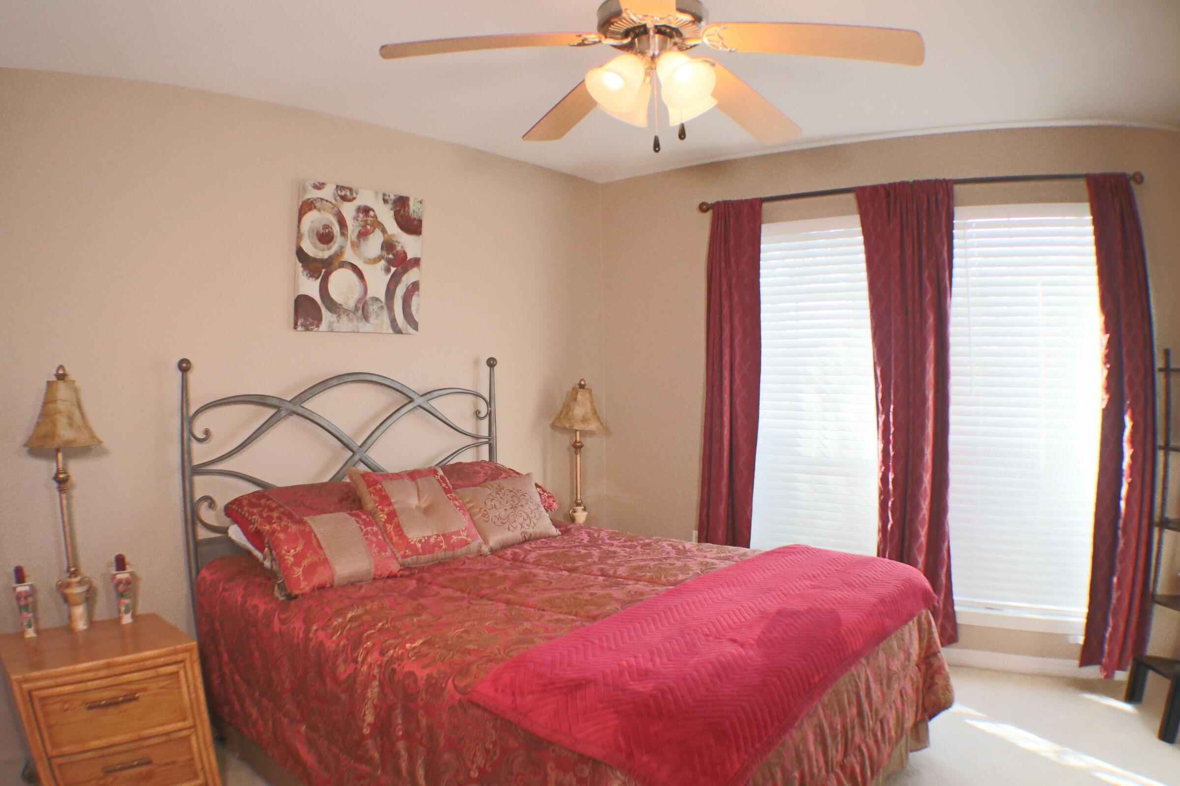 564 East Shipwreck Road Santa Rosa Beach, FL 32459 - Photo 22 of 38 a bedroom with a bed and a chandelier