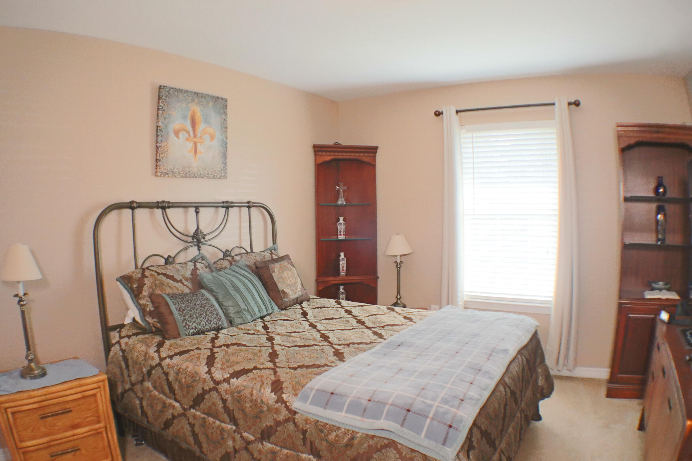 564 East Shipwreck Road Santa Rosa Beach, FL 32459 - Photo 25 of 38 a bedroom with a bed and a chandelier