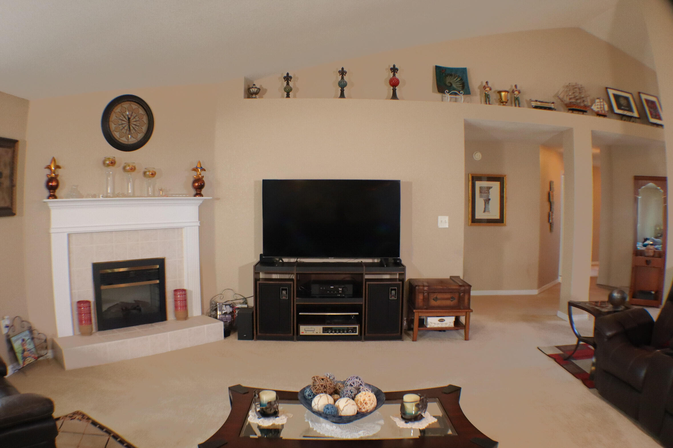 564 East Shipwreck Road Santa Rosa Beach, FL 32459 - Photo 6 of 38 a living room with furniture a flat screen tv and a fireplace