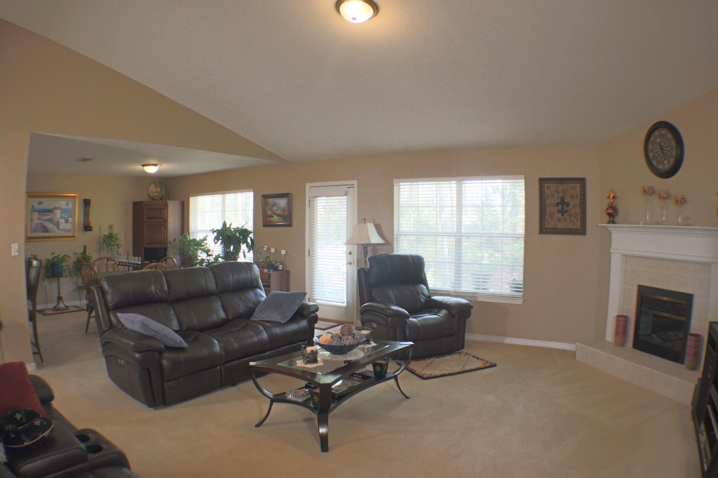 564 East Shipwreck Road Santa Rosa Beach, FL 32459 - Photo 9 of 38 a living room with furniture and a fireplace