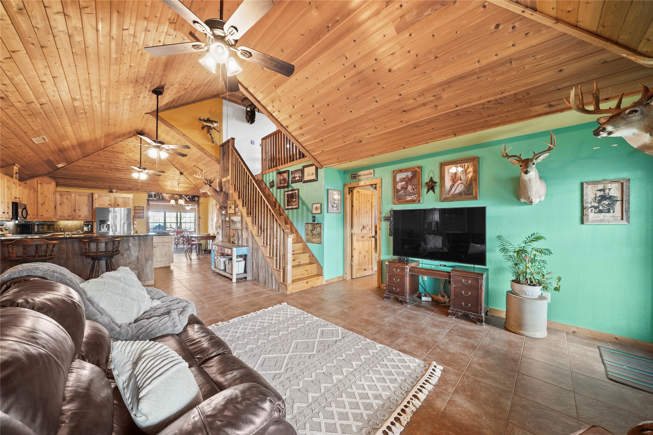 6710 Boothline Road Richmond, TX 77469 - Photo 11 of 43 a living room with furniture and a flat screen tv