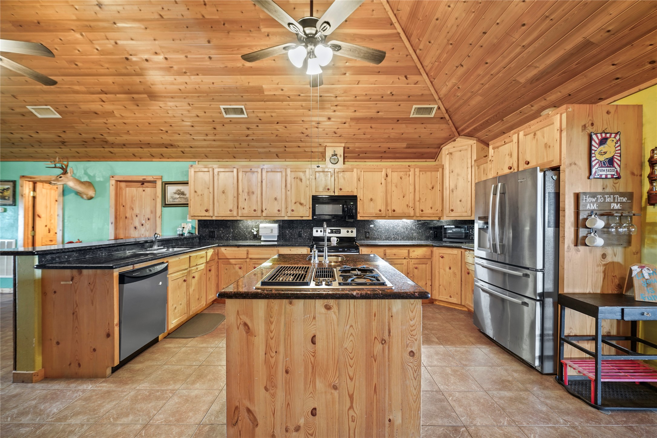 6710 Boothline Road Richmond, TX 77469 - Photo 14 of 43 a kitchen with granite countertop a stove and refrigerator