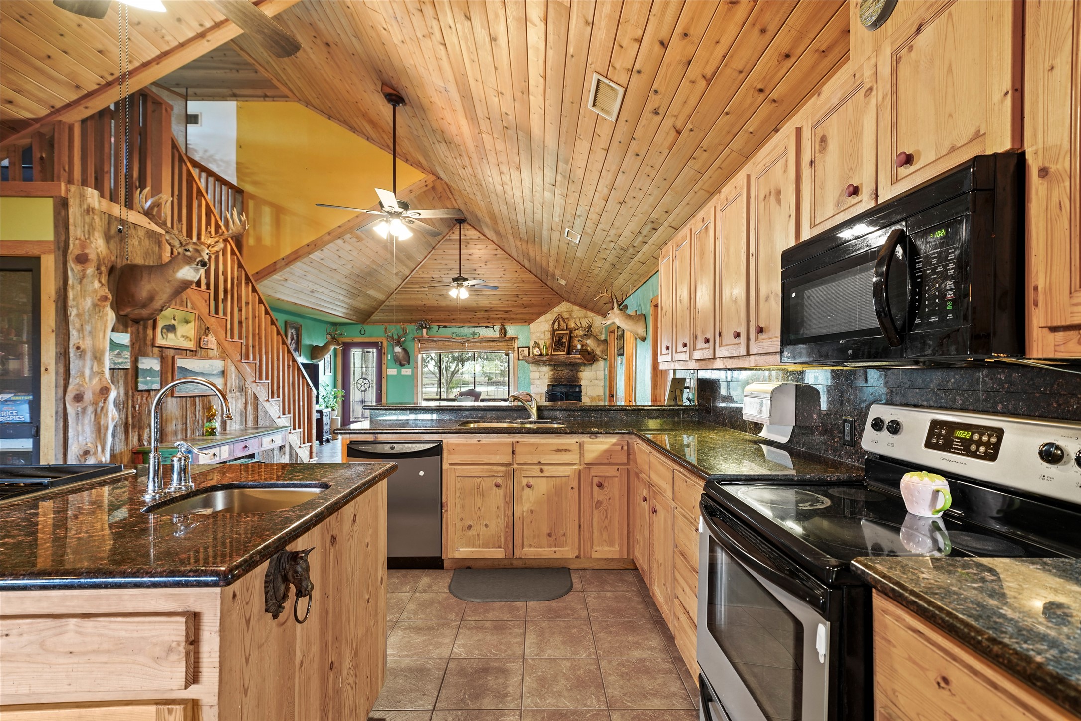 6710 Boothline Road Richmond, TX 77469 - Photo 15 of 43 a kitchen with stainless steel appliances granite countertop a sink a stove top oven a counter space and cabinets