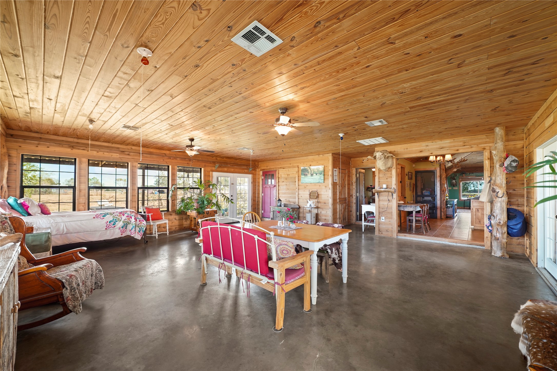 6710 Boothline Road Richmond, TX 77469 - Photo 18 of 43 a living room with furniture a flat screen tv and a large window