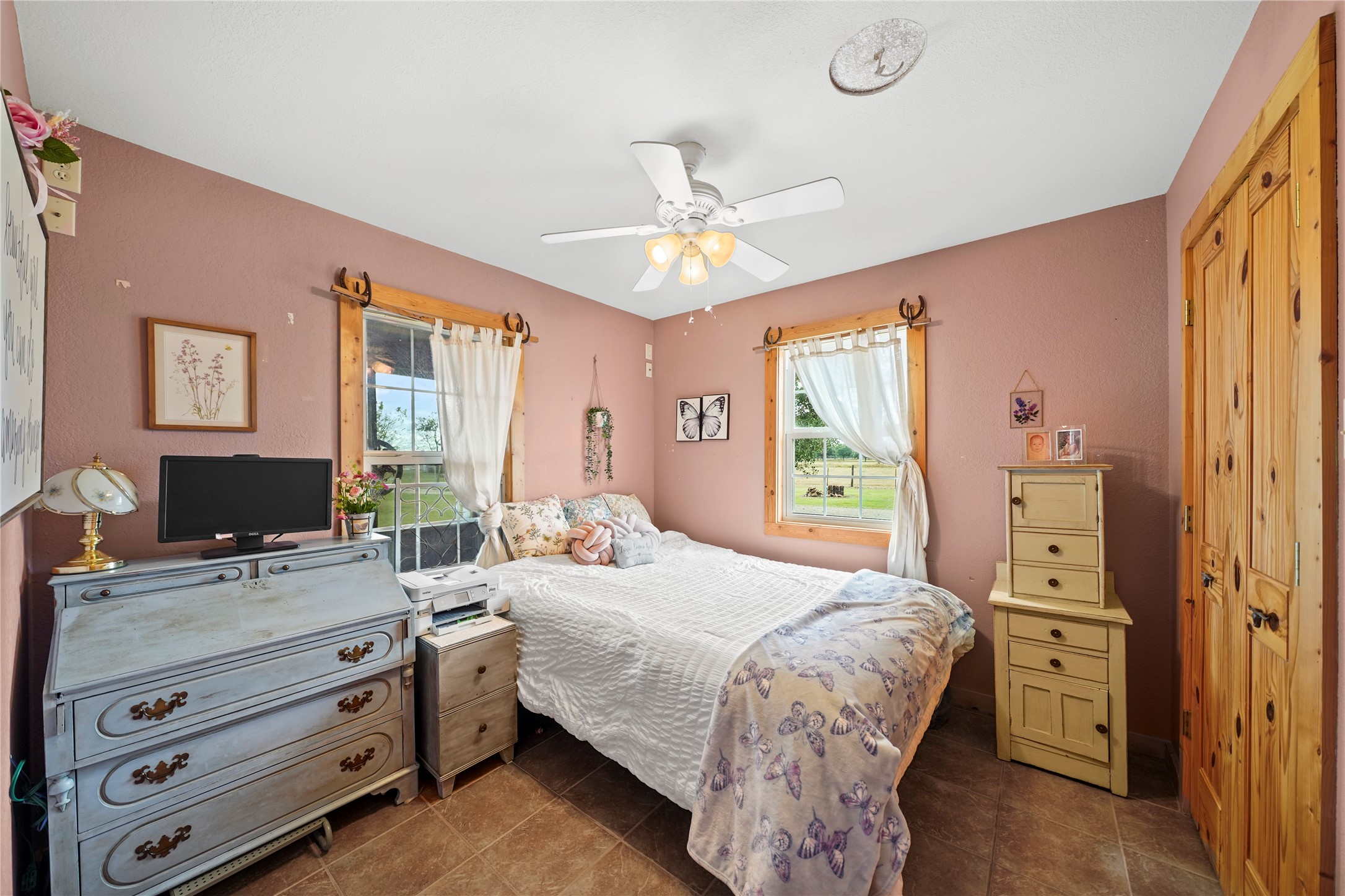 6710 Boothline Road Richmond, TX 77469 - Photo 23 of 43 a bedroom with a bed and a chandelier