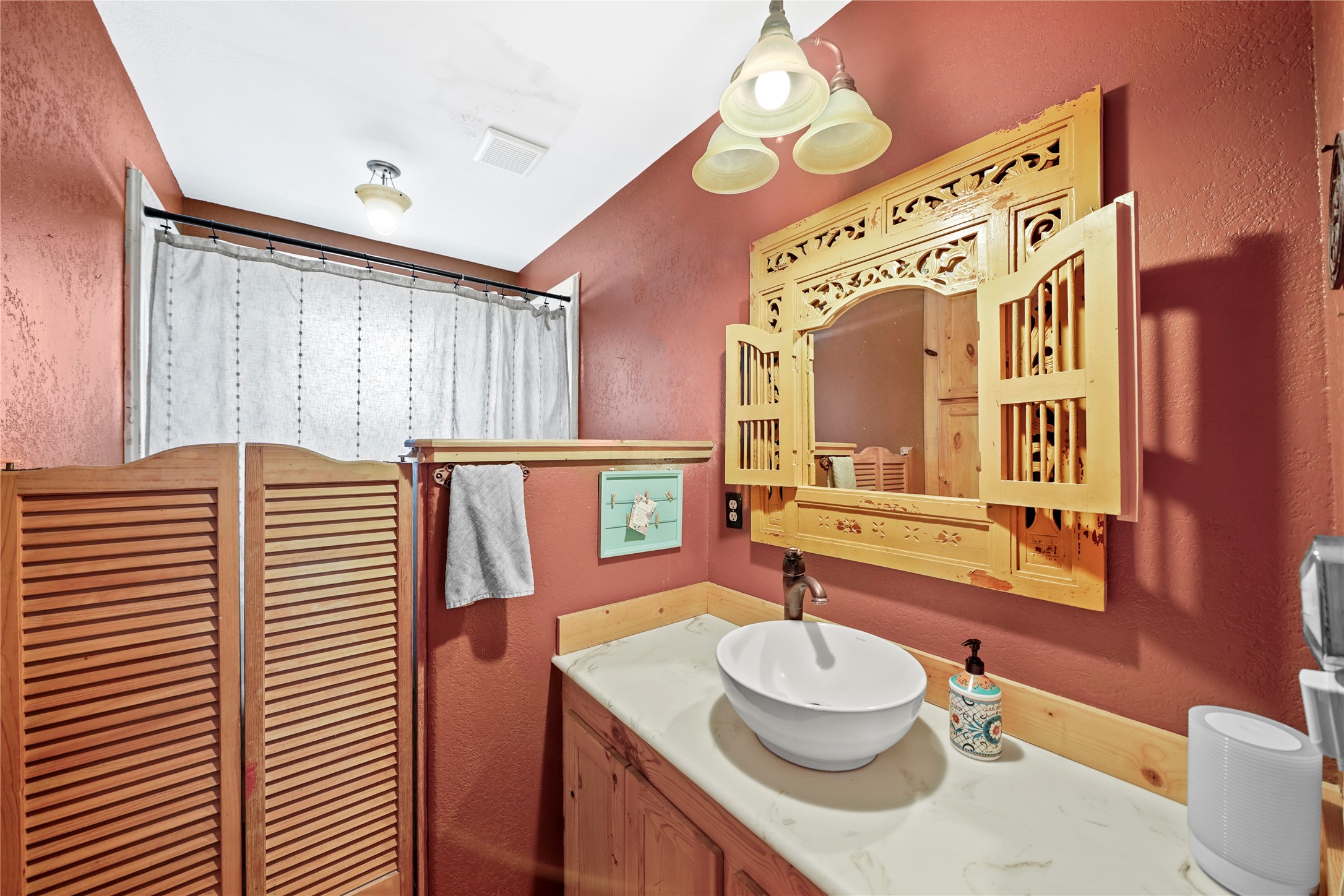 6710 Boothline Road Richmond, TX 77469 - Photo 24 of 43 a bathroom with a granite countertop sink and a mirror