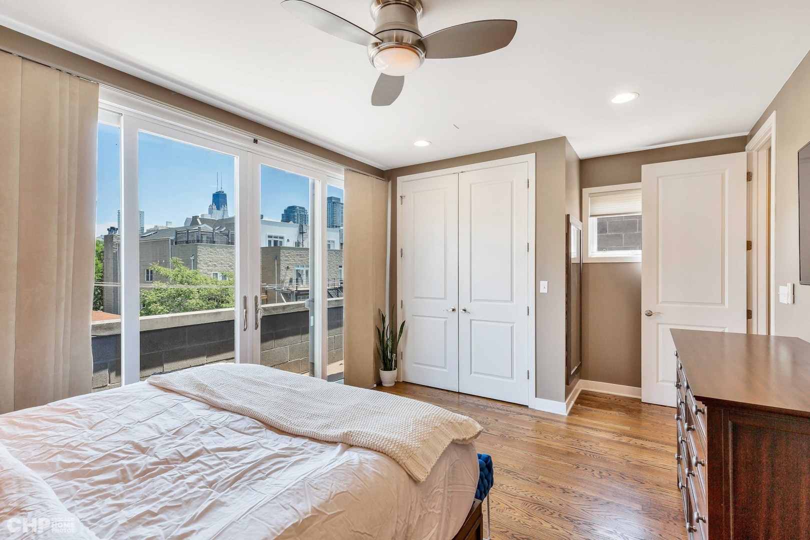 1331 North Mohawk Street, Unit 3 Chicago, IL 60610 - Photo 12 of 28 a bedroom with a bed and a large window
