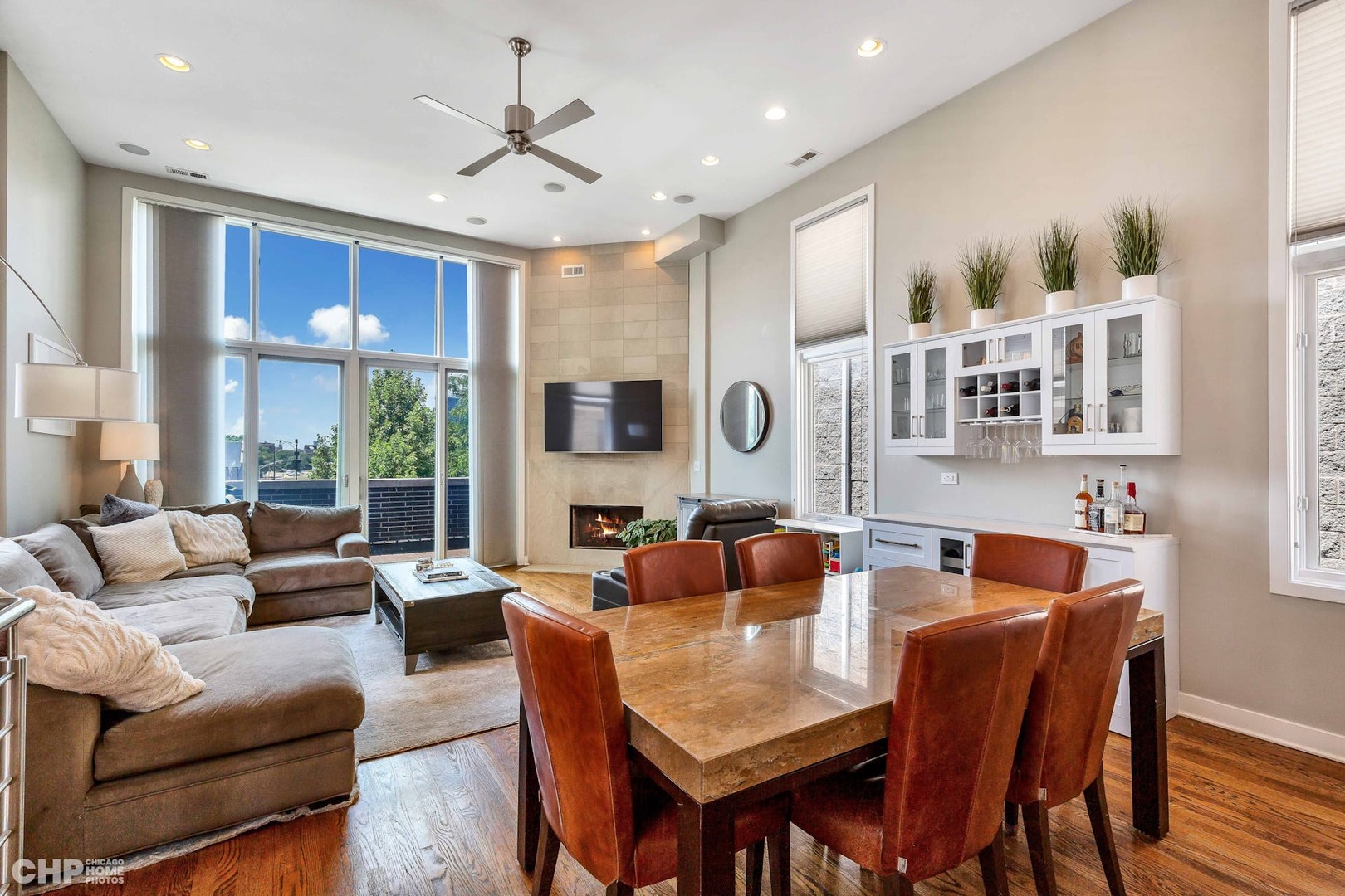 1331 North Mohawk Street, Unit 3 Chicago, IL 60610 - Photo 2 of 28 a dining room with furniture a large window and a chandelier
