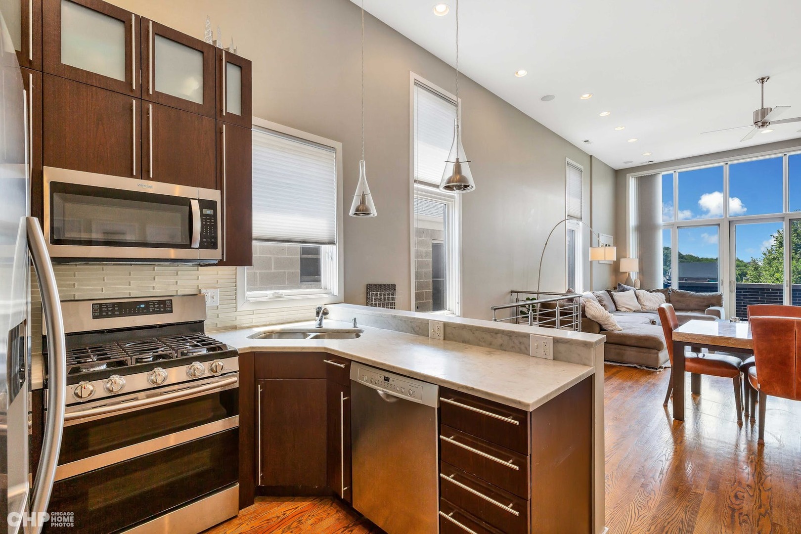 1331 North Mohawk Street, Unit 3 Chicago, IL 60610 - Photo 7 of 28 a kitchen with a stove a sink and a microwave