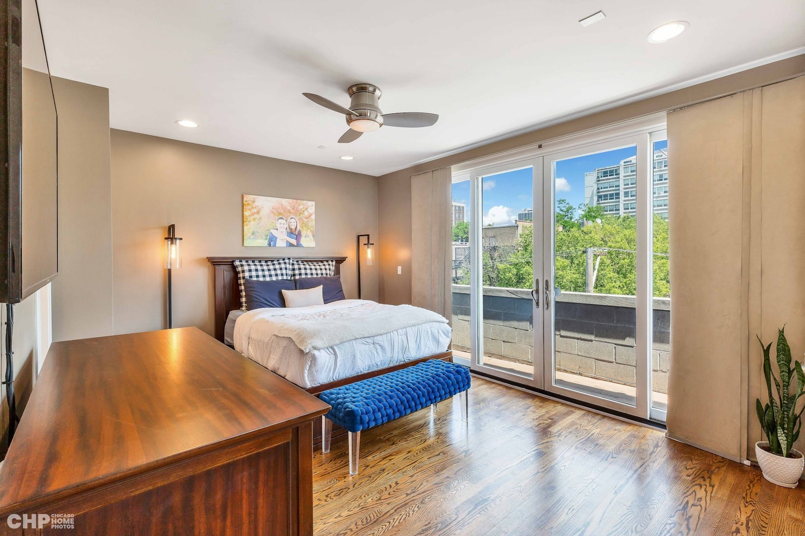 1331 North Mohawk Street, Unit 3 Chicago, IL 60610 - Photo 10 of 28 a bedroom with a large bed and a chandelier