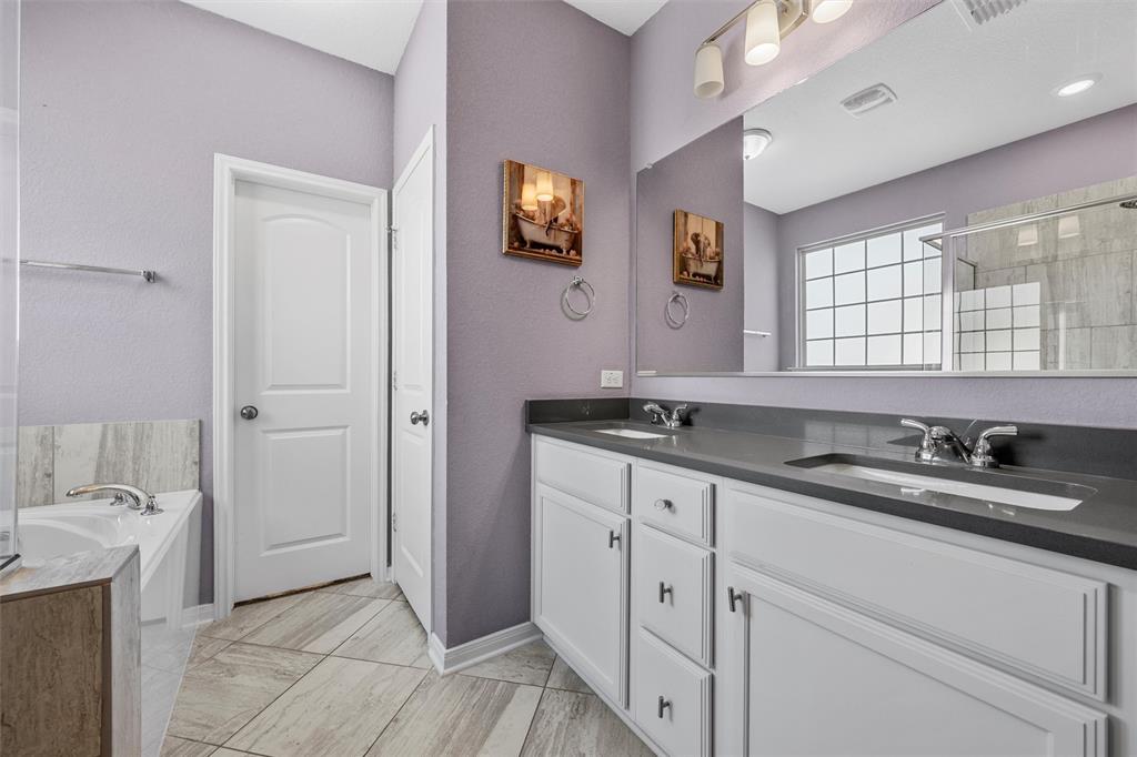 11308 Gulch Drive Lorena, TX 76655 - Photo 17 of 40 a bathroom with double sink and a mirror