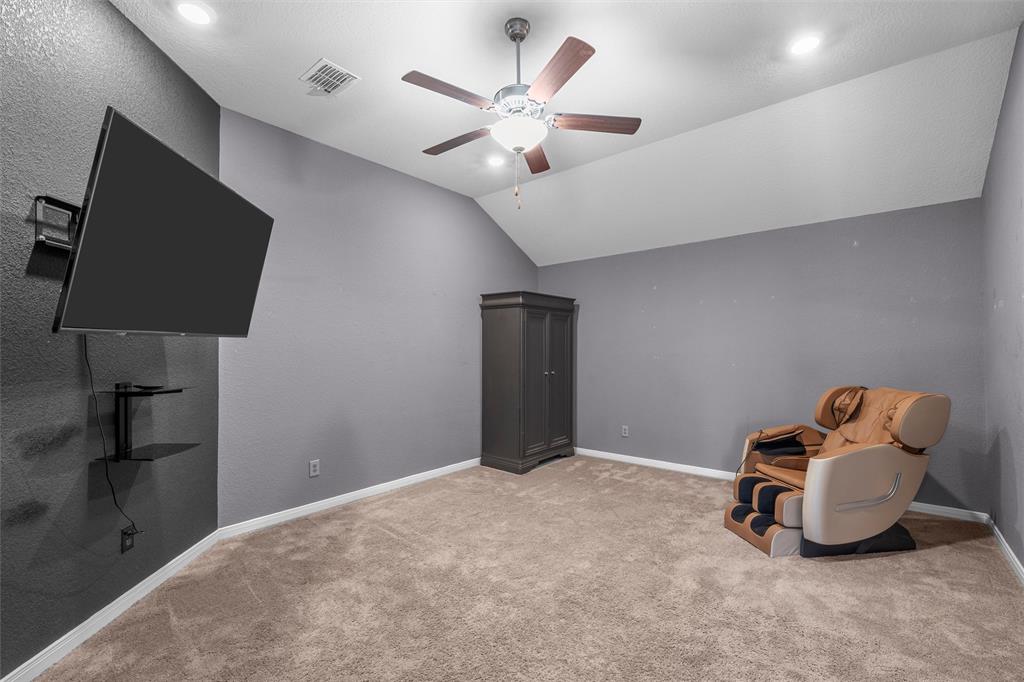 11308 Gulch Drive Lorena, TX 76655 - Photo 26 of 40 a room with furniture and a flat screen tv