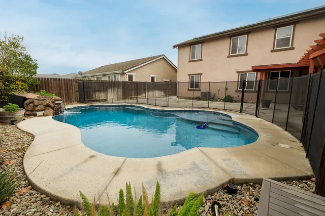 a view of a house with swimming pool