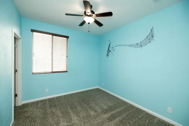 a bathroom with a granite countertop sink a large mirror and a shower
