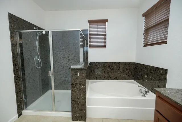 a view of a swimming pool with a yard