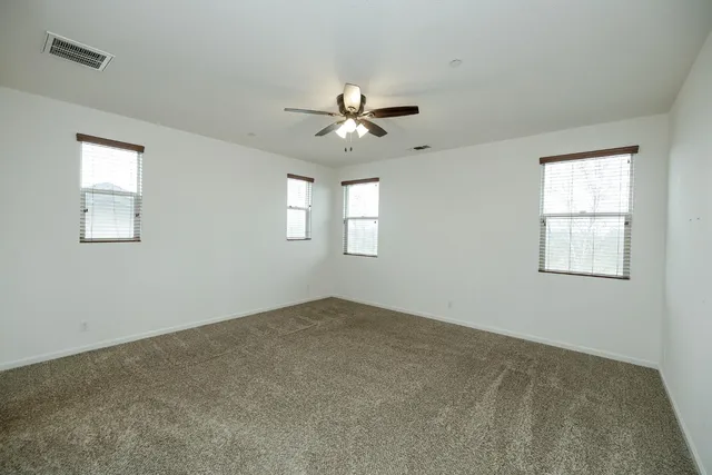 a view of a porch with wooden fence