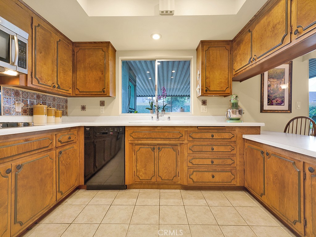 5092 Berkeley Avenue Westminster, CA 92683 - Photo 10 of 39 a kitchen with a sink a stove and cabinets