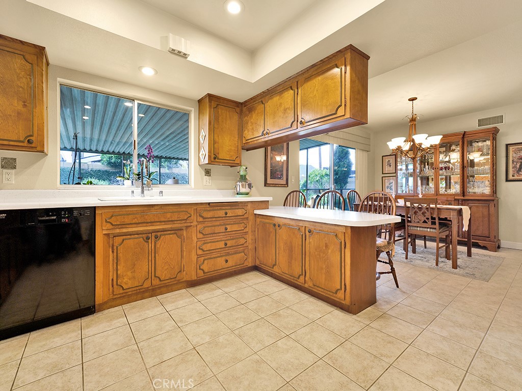 5092 Berkeley Avenue Westminster, CA 92683 - Photo 11 of 39 a kitchen with a sink stove and cabinets