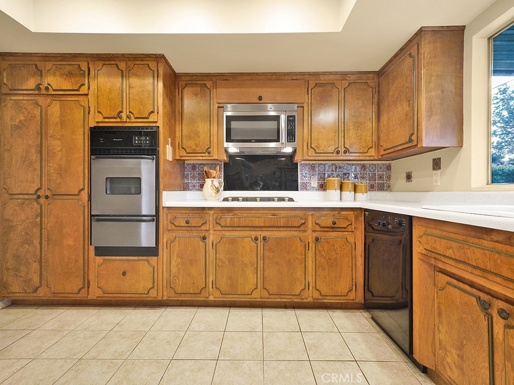 5092 Berkeley Avenue Westminster, CA 92683 - Photo 12 of 39 a kitchen with stainless steel appliances granite countertop a refrigerator and a stove top oven