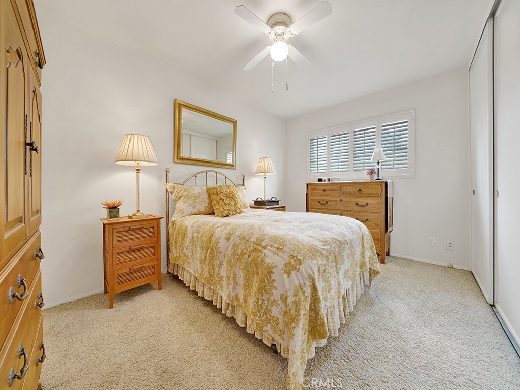 5092 Berkeley Avenue Westminster, CA 92683 - Photo 26 of 39 a bedroom with a bed and a chandelier