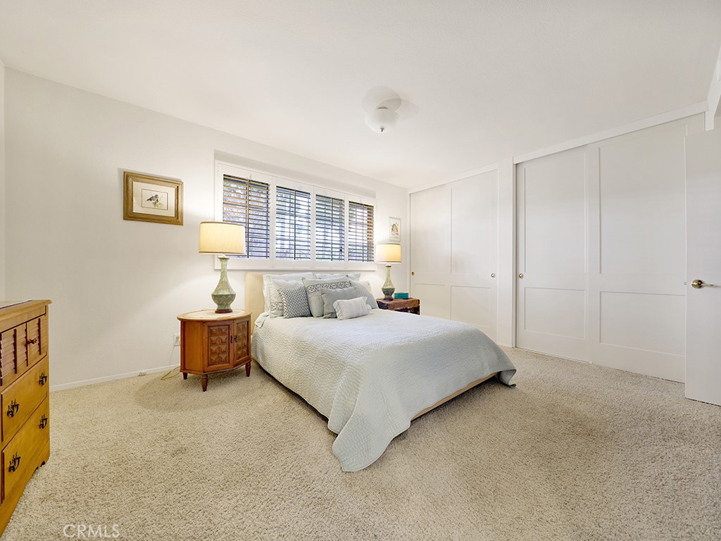 5092 Berkeley Avenue Westminster, CA 92683 - Photo 32 of 39 a bedroom with a bed and a flat tv screen on the dresser