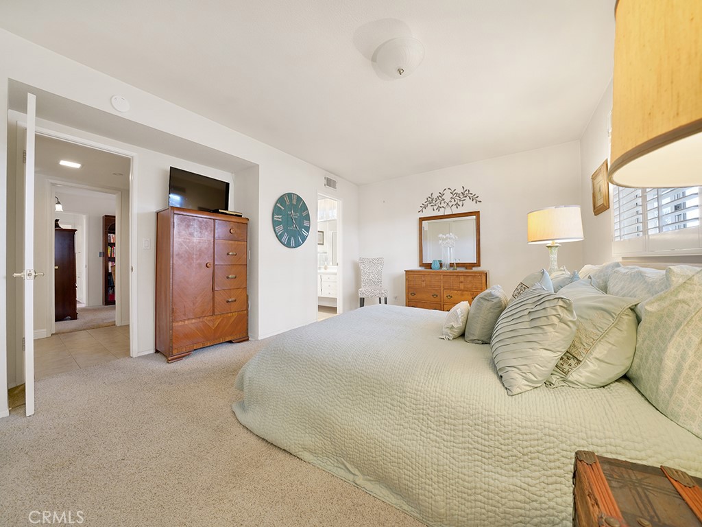 5092 Berkeley Avenue Westminster, CA 92683 - Photo 35 of 39 a bedroom with a large bed and a couch