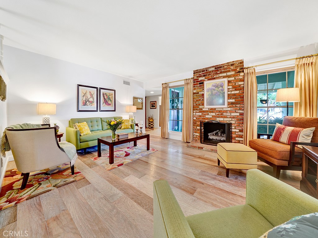 5092 Berkeley Avenue Westminster, CA 92683 - Photo 3 of 39 a living room with furniture and a fireplace