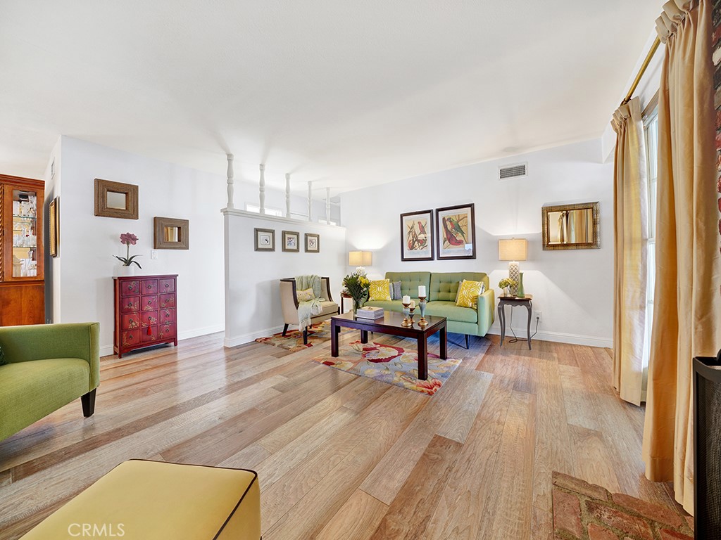 5092 Berkeley Avenue Westminster, CA 92683 - Photo 4 of 39 a living room with furniture and painting on the wall next to a window