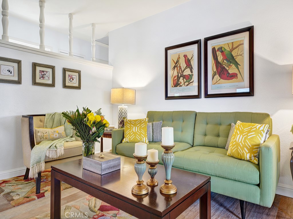 5092 Berkeley Avenue Westminster, CA 92683 - Photo 5 of 39 a living room with furniture a couch and paintings on the wall