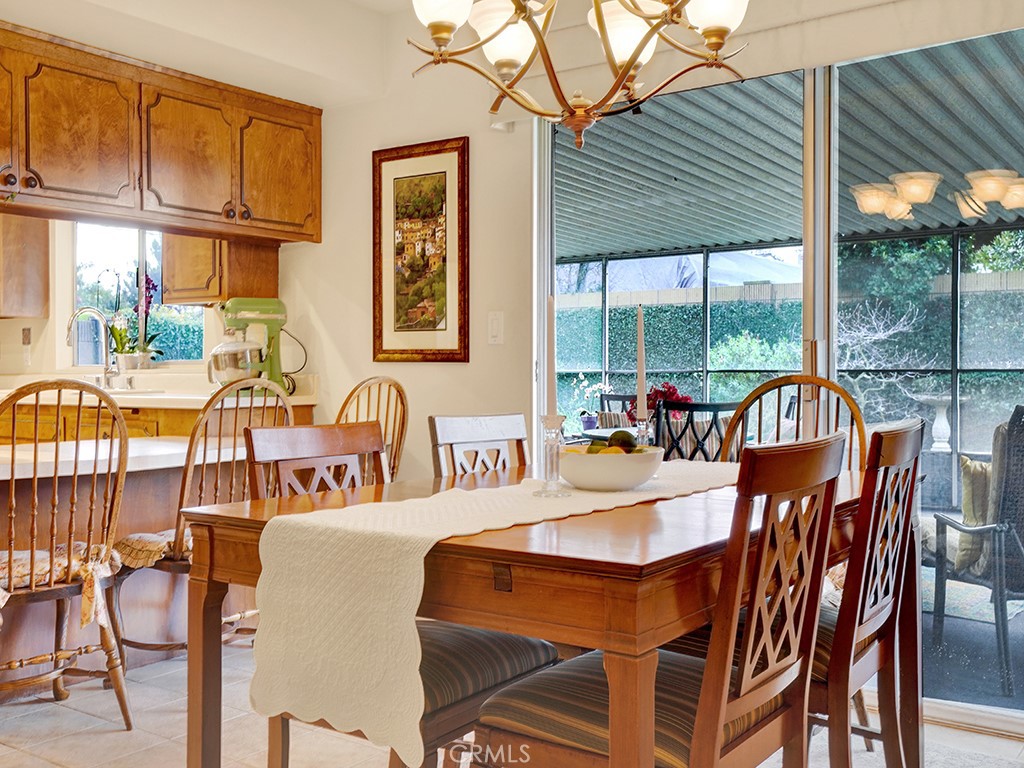 5092 Berkeley Avenue Westminster, CA 92683 - Photo 7 of 39 a dining room with furniture floor to ceiling windows and wooden floor