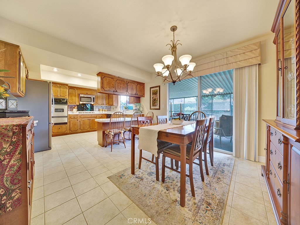 5092 Berkeley Avenue Westminster, CA 92683 - Photo 8 of 39 a view of a dining room with furniture and a chandelier