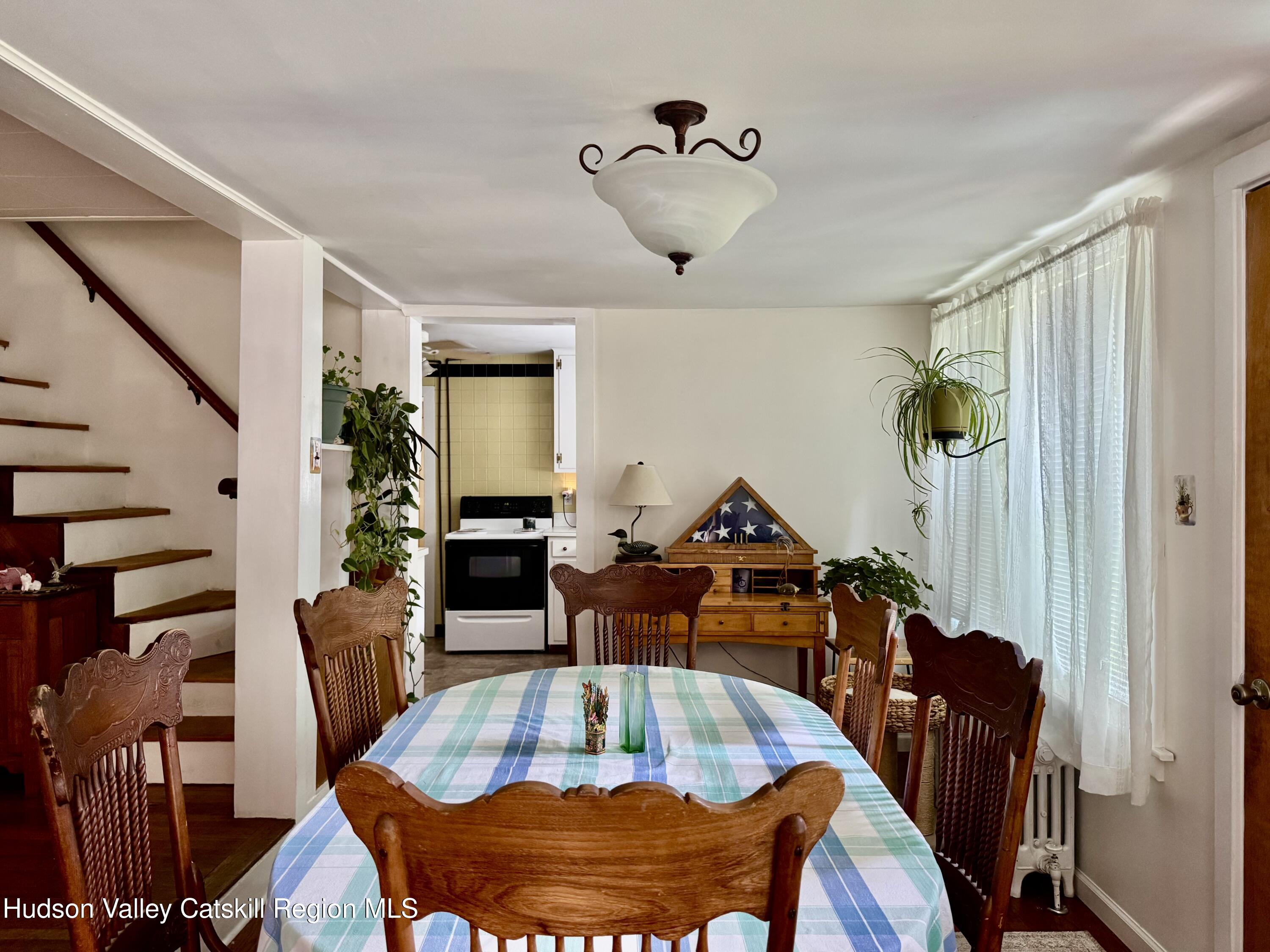 189-195 Vedder Road Catskill, NY 12414 - Photo 11 of 39 a living room with furniture and a wooden floor