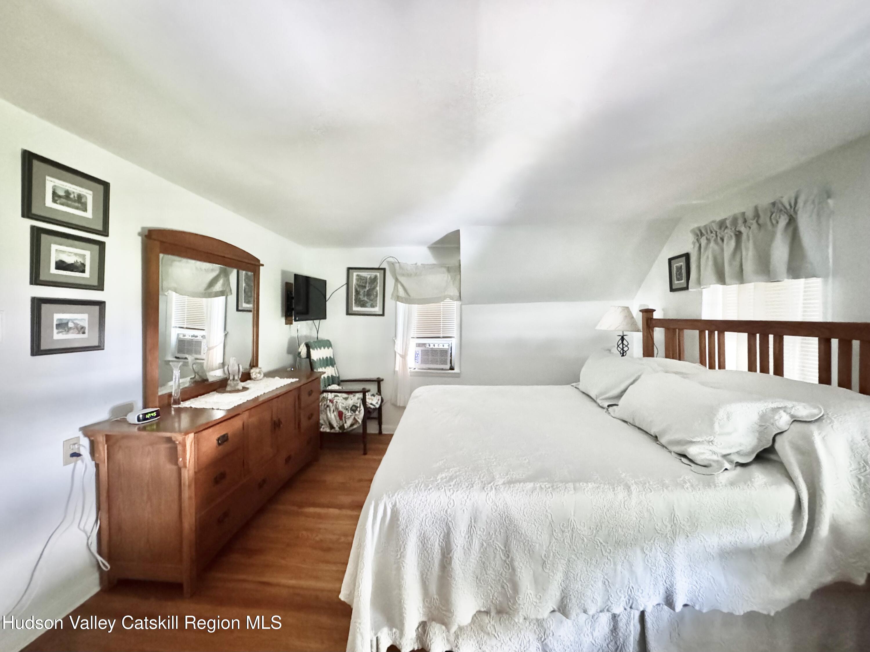 189-195 Vedder Road Catskill, NY 12414 - Photo 17 of 39 a bed room with a bed and a large window