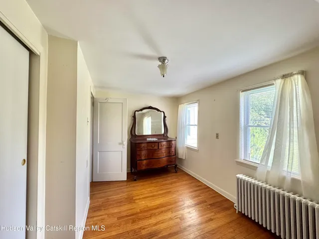 a view of a hardwood floor in a room